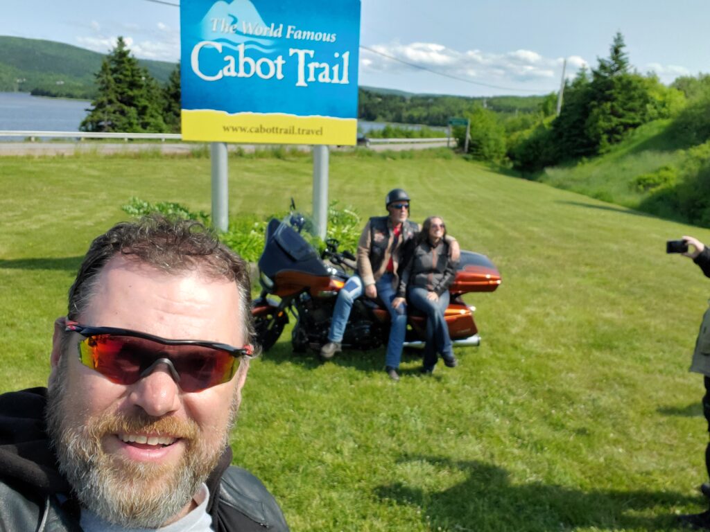Motorcycle in front of Cabot Trail sign
